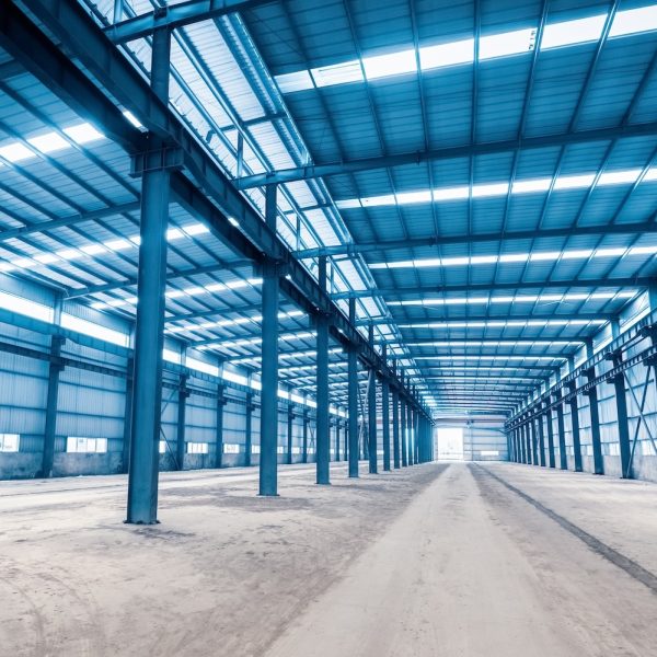 empty steel structure building, abandoned factory workshop or warehouse background